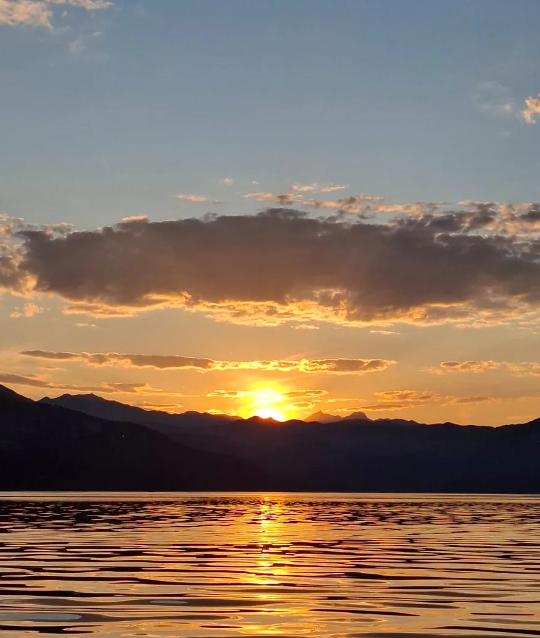 The sun setting in golden light over Skadar Lake
