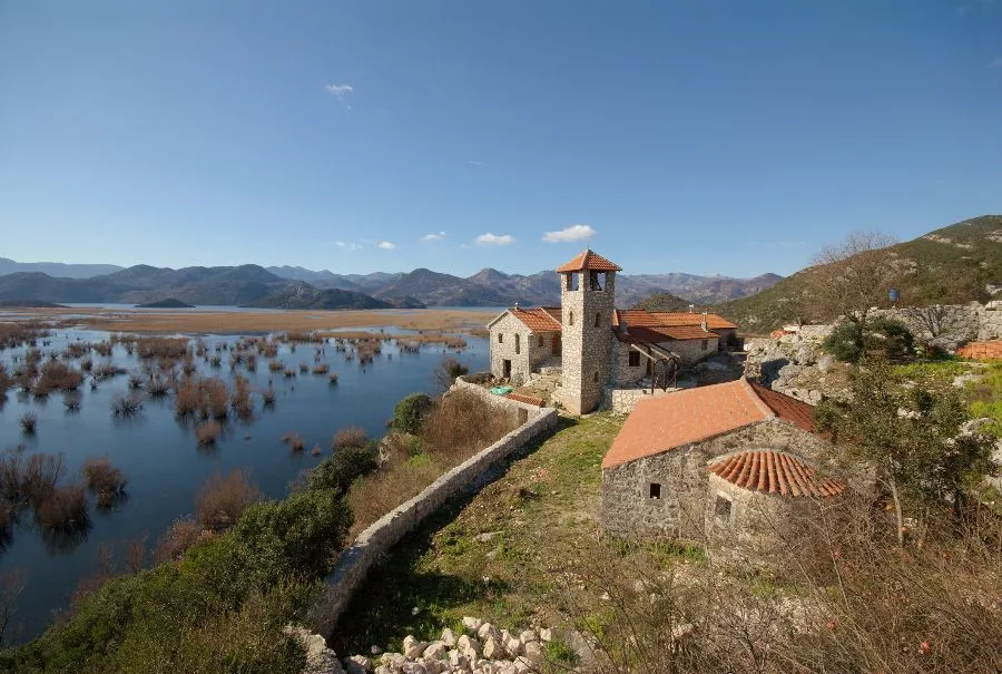 The island Monastery of Kom rising from Skadar Lake